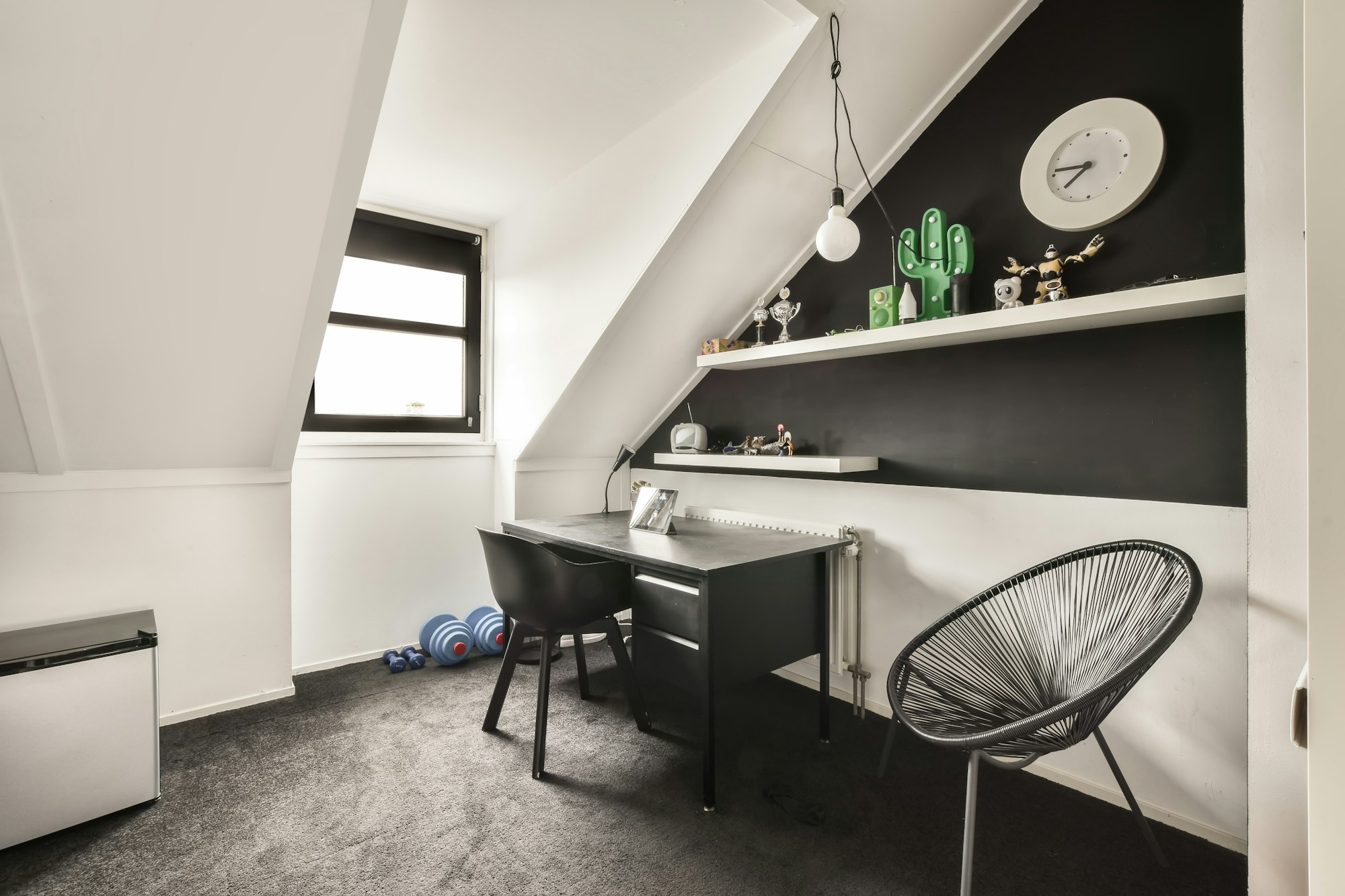 A small workplace on a carpet floor