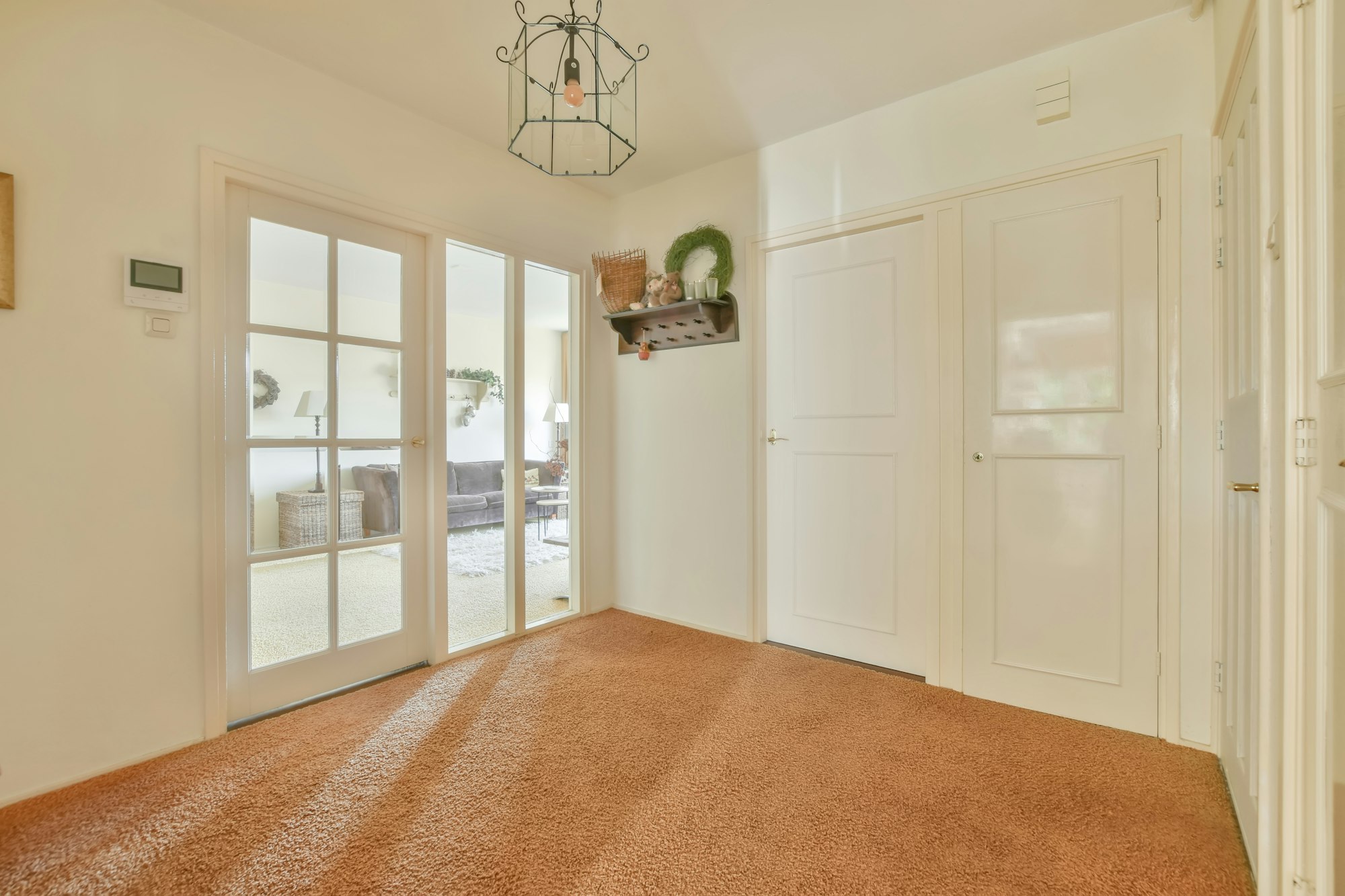 Spacious hallway with carpeted floor