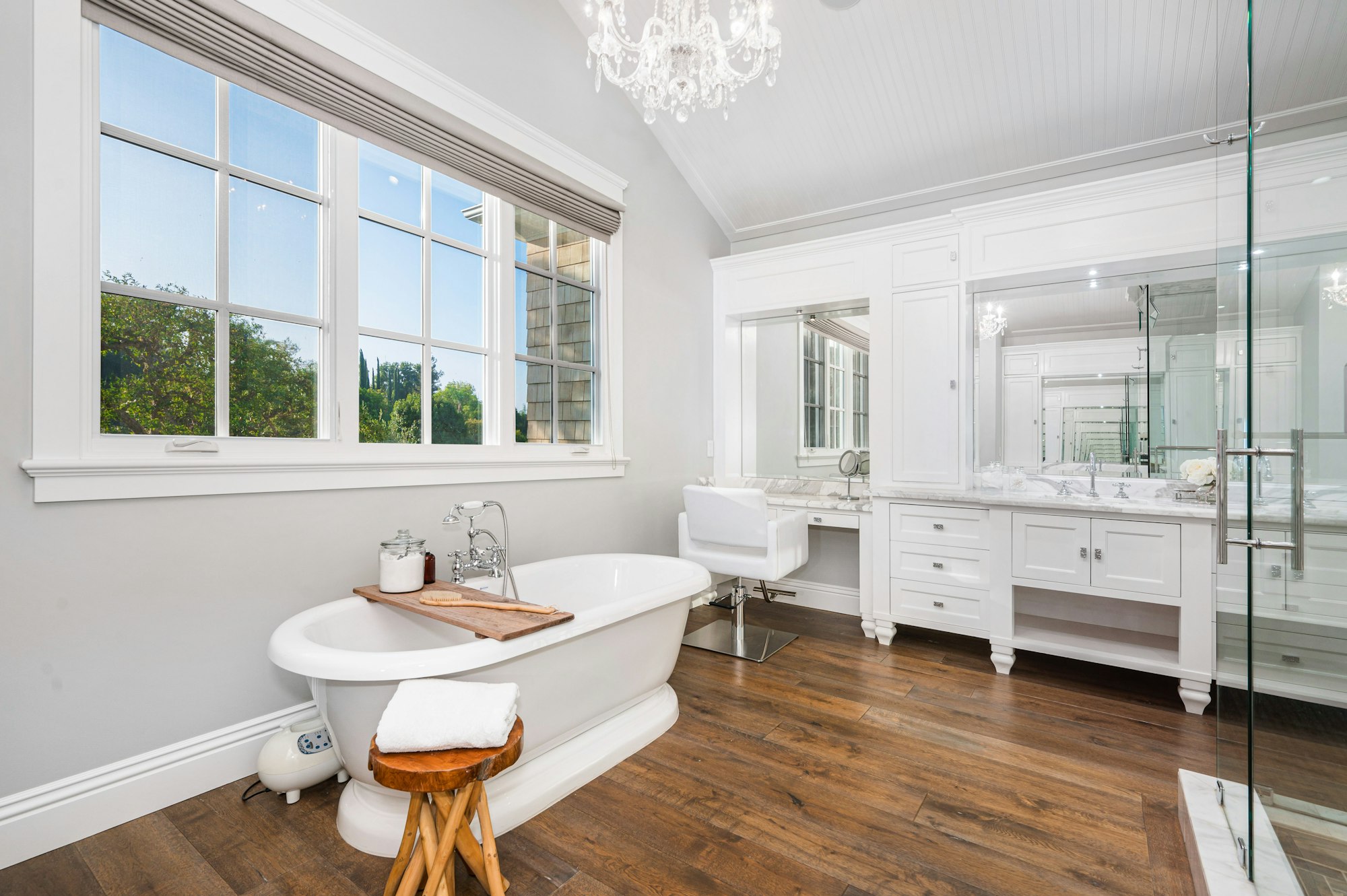 Stylish bathroom with wooden floors in new construction home in Encino, California
